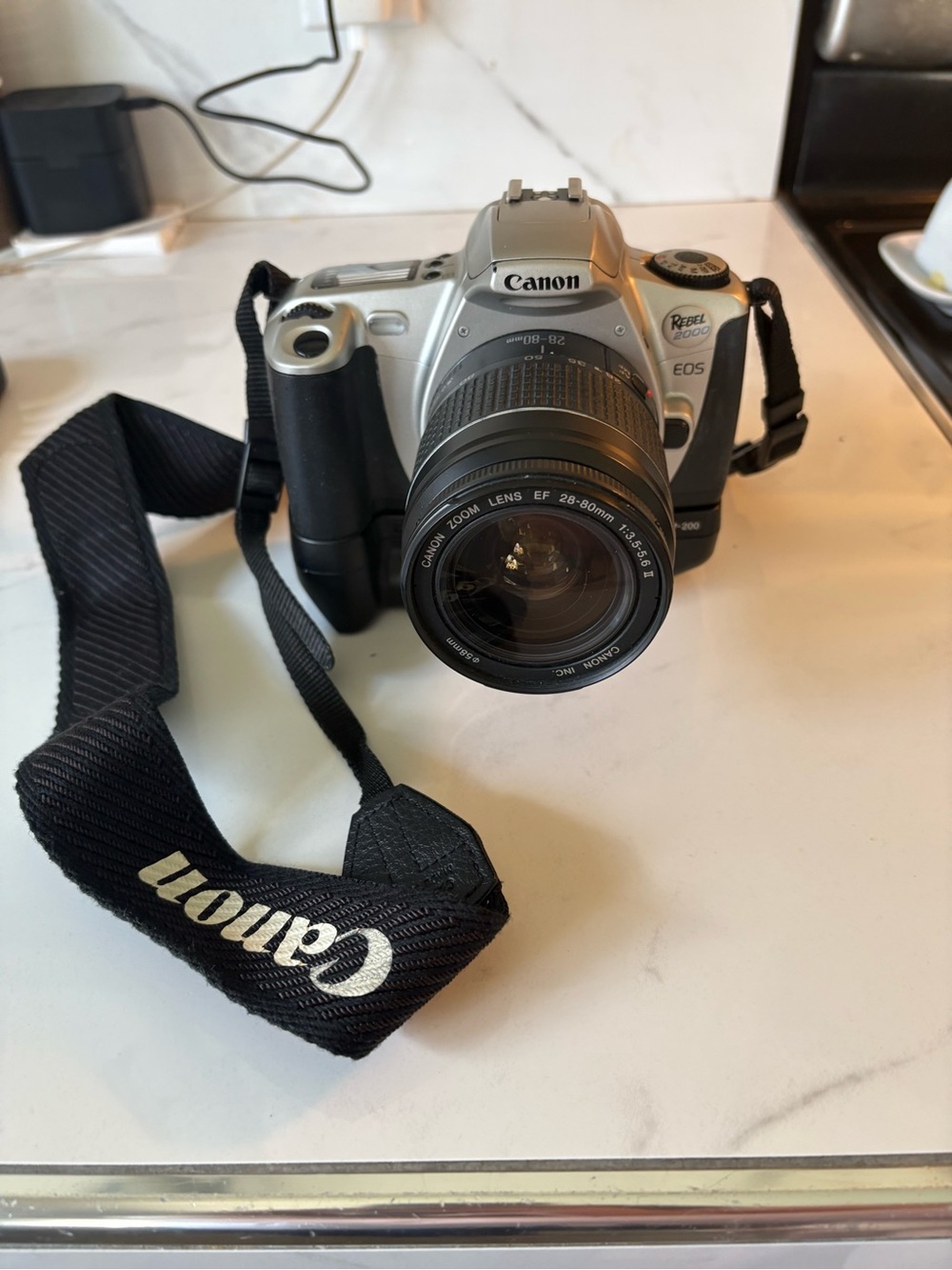 Canon Silver Rebel 2000 35mm film with EF 28-80mm Zoom Lens and Branded Strap